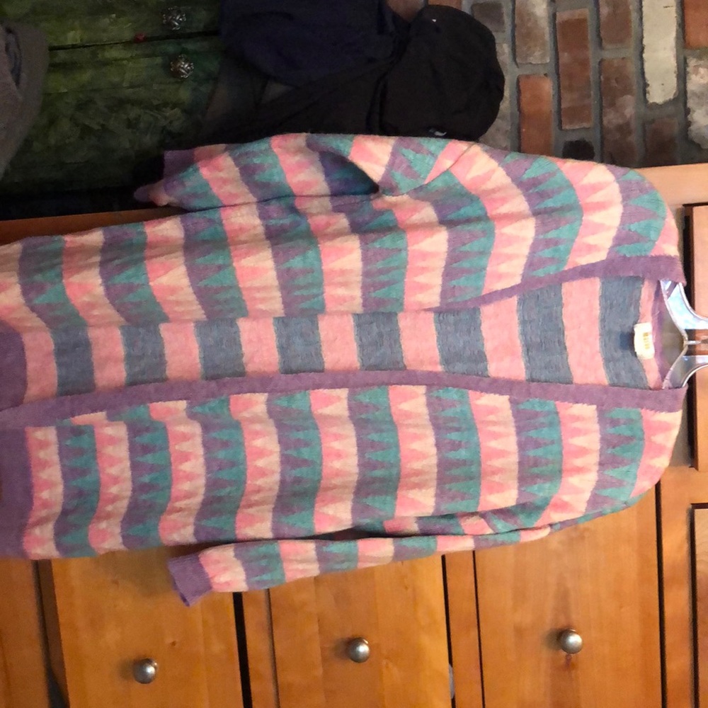 Diamond print,Anthropologie sweater that is pink ,teal ,purple and light pink.